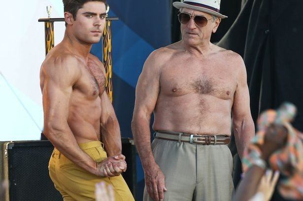 Zac-Efron-and-Robert-De-Niro-take-off-their-shirts-for-a-Flex-Off-contest-in-a-scene-for-their-new-movie-Dirty-Grandpa